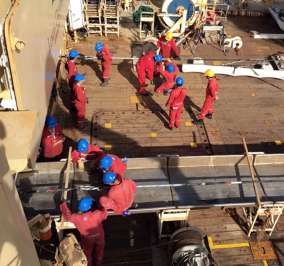 Cable retrieval works underway on the Coral Sea Cable laying vessel, the Ile de Brehat. (Credit: ASN)