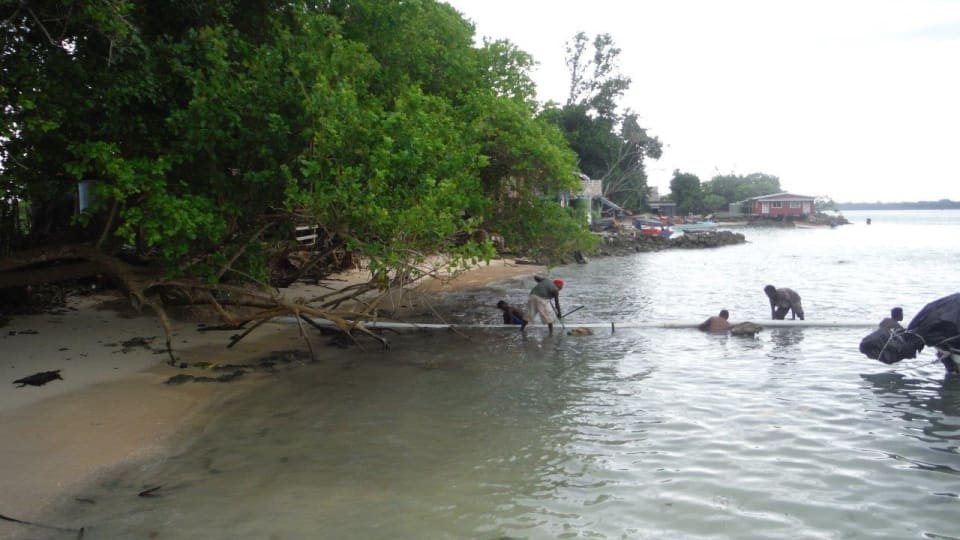 Fitting of the seaward ducts in Taro, Solomon Islands. (Credit: SISCC)